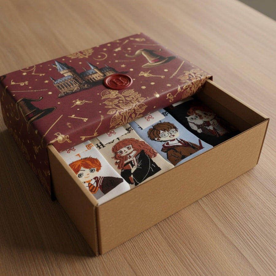 Illustrated collector box opened to show Harry Potter-themed socks